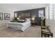 Stylish main bedroom with a grey accent wall and plush rug at 3384 Cranston Cir, Highlands Ranch, CO 80126