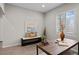 Well-lit office featuring neutral colors, comfortable bench seating, and a modern aesthetic at 3384 Cranston Cir, Highlands Ranch, CO 80126