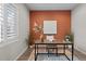 Bright office space with textured wall, contemporary decor, and a comfortable work area at 3384 Cranston Cir, Highlands Ranch, CO 80126