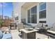 A deck with a fire pit and chairs, ideal for outdoor entertaining and relaxing at 10534 Oncilla Ln, Lone Tree, CO 80124