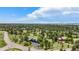 Wide aerial view of a charming home nestled among mature trees and green spaces in a quiet community at 5542 Ponderosa Dr, Parker, CO 80134
