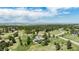 Expansive aerial view of the property, showcasing its generous lot size, mature trees, and scenic views at 5542 Ponderosa Dr, Parker, CO 80134