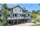 Picture of a spacious backyard with a two-tier deck, outdoor seating, and serene surroundings at 5542 Ponderosa Dr, Parker, CO 80134