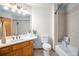 Bathroom features a vanity and tiled shower with storage shelf, providing a functional and stylish space at 5542 Ponderosa Dr, Parker, CO 80134