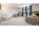 Comfortable bedroom with two twin beds and a crib, perfect for children or guests at 5542 Ponderosa Dr, Parker, CO 80134