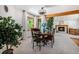 Dining room with a round table, chairs, and a fireplace in the background, next to large windows at 5542 Ponderosa Dr, Parker, CO 80134