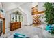 Stunning living room featuring high ceilings, natural light, and an open staircase at 5542 Ponderosa Dr, Parker, CO 80134