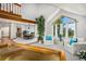 Bright and airy living room with vaulted ceilings, large windows, and elegant decor at 5542 Ponderosa Dr, Parker, CO 80134