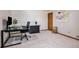 Well-lit office space with a desk, chair, and ample storage for a productive work environment at 5542 Ponderosa Dr, Parker, CO 80134