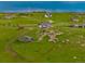Scenic aerial view featuring multiple homes scattered across green hills and open land at 28495 La Donna Vista Ln, Elizabeth, CO 80107
