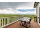 Outdoor deck features a tile-top table and chairs with an expansive view of the green plains at 28495 La Donna Vista Ln, Elizabeth, CO 80107