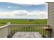 Outdoor deck features a tile-top table and chairs with a scenic view of the lush plains at 28495 La Donna Vista Ln, Elizabeth, CO 80107