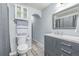 Bathroom with modern gray vanity, white marble countertop, gray fixtures, and gray vinyl flooring at 28495 La Donna Vista Ln, Elizabeth, CO 80107