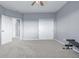 Spacious bedroom with carpet flooring, a sliding closet door, and lots of natural light at 28495 La Donna Vista Ln, Elizabeth, CO 80107
