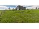 Charming two-story gray home with a grassy front yard and lots of open space at 28495 La Donna Vista Ln, Elizabeth, CO 80107