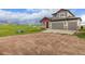 Charming two-story home with a three-car garage and large driveway in a rural setting at 28495 La Donna Vista Ln, Elizabeth, CO 80107