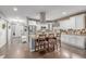 Elegant kitchen with white cabinets, granite countertops, and a stainless steel range hood over the island at 28495 La Donna Vista Ln, Elizabeth, CO 80107