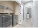 Efficient laundry area featuring modern washer and dryer units, plus ample shelving at 28495 La Donna Vista Ln, Elizabeth, CO 80107