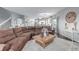 Open-concept living room with hardwood floors and a view into the kitchen at 28495 La Donna Vista Ln, Elizabeth, CO 80107