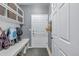 Functional mud room with built-in storage, bench, and multiple hooks for organization at 28495 La Donna Vista Ln, Elizabeth, CO 80107