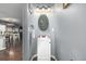 Cozy powder room features a white vanity and decorative mirror; view to dining area at 28495 La Donna Vista Ln, Elizabeth, CO 80107
