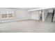 Large unfinished basement area featuring neutral carpet and a staircase at 10114 Atlanta St, Parker, CO 80134