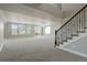 Finished basement boasts plush carpet, natural light from many windows, and stairway at 10114 Atlanta St, Parker, CO 80134