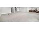Spacious unfinished basement with gray carpet and stairs leading to the main floor at 10114 Atlanta St, Parker, CO 80134