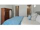 Comfortable bedroom featuring blue duvet cover and ensuite bathroom at 10114 Atlanta St, Parker, CO 80134