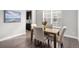 Dining room features natural light, wood floors, and neutral decor at 10114 Atlanta St, Parker, CO 80134