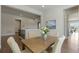 Bright and airy dining room featuring wood table and comfortable seating at 10114 Atlanta St, Parker, CO 80134
