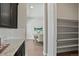 Open-concept dining area with modern decor and access to kitchen and hallway at 10114 Atlanta St, Parker, CO 80134