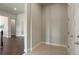 Open hallway with hardwood floors leading to the front door and living areas at 10114 Atlanta St, Parker, CO 80134