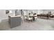 Open-concept living room featuring a kitchen island, dining area, and a billiards table for entertaining at 10114 Atlanta St, Parker, CO 80134