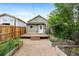 Backyard with a new wood deck, mulch, and greenery at 2841 Stout St, Denver, CO 80205