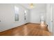 Bright bedroom with hardwood floors, white walls, and ample natural light at 2841 Stout St, Denver, CO 80205