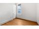This bedroom has a window and closet with wood-colored flooring at 2841 Stout St, Denver, CO 80205