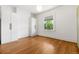 Bedroom featuring hardwood floors and plenty of storage with built-in wardrobes at 2841 Stout St, Denver, CO 80205