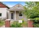 Inviting home showcasing a cozy front porch and wrought-iron fence for curb appeal at 2841 Stout St, Denver, CO 80205