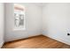 This room features hardwood floors, and a large window at 2841 Stout St, Denver, CO 80205