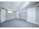 Bedroom features gray carpet, neutral paint, built in storage, and multiple windows at 5350 E 66Th Way, Commerce City, CO 80022