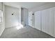 Bright bedroom with plush carpet, ample closet space, and neutral paint at 5350 E 66Th Way, Commerce City, CO 80022