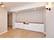 Bonus room with built in cabinets and updated wood-look floors at 5350 E 66Th Way, Commerce City, CO 80022