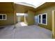 Covered courtyard featuring a white door, and white windows with a view to another area of the property at 5350 E 66Th Way, Commerce City, CO 80022