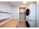 Convenient laundry room with storage, folding table and washer/dryer at 5350 E 66Th Way, Commerce City, CO 80022