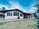 Lawn of property showing large windows and a grill on a patio at 7194 S Himalaya Way, Centennial, CO 80016
