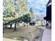 View of the lawn showing the back of the house and an outbuilding at 7194 S Himalaya Way, Centennial, CO 80016