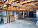 View of the barn interior showing multiple stalls with metal bars and wooden accents along with a door at 7194 S Himalaya Way, Centennial, CO 80016