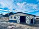 Exterior view of a barn on the property, showing an open door at 7194 S Himalaya Way, Centennial, CO 80016