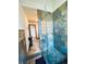 Modern bathroom with a tiled walk-in shower, glass block accents, and sleek fixtures at 7194 S Himalaya Way, Centennial, CO 80016